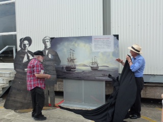 What was it like for those on the ships if a bit of wind blows away the commemorative board?
